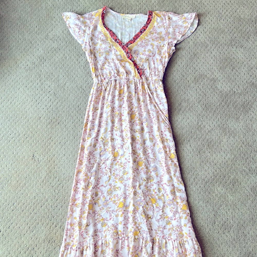 Pink and yellow floral maxi dress, cinched waistline and coral floral details.